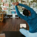 집에서 시작하는 소소한 건강 챙기기, 일상 속 실천법으로 인기 a man doing yoga in a living room